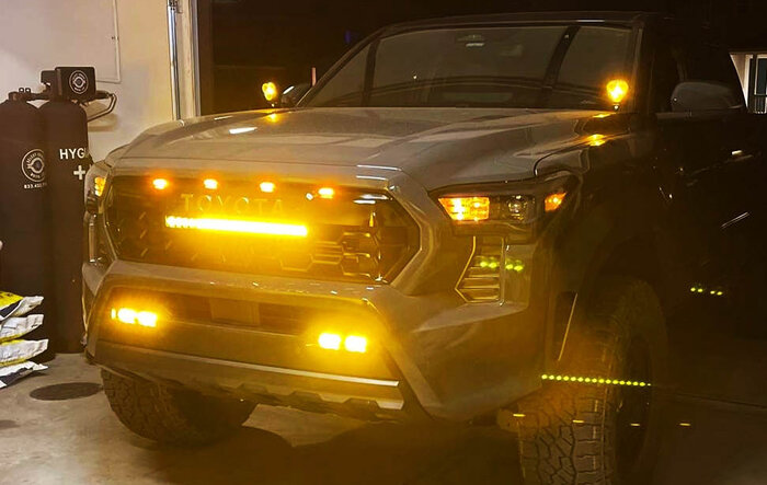 Heretic light bar, Baja fog lights & Raptor aftermarket lights installed in TRD Pro grill